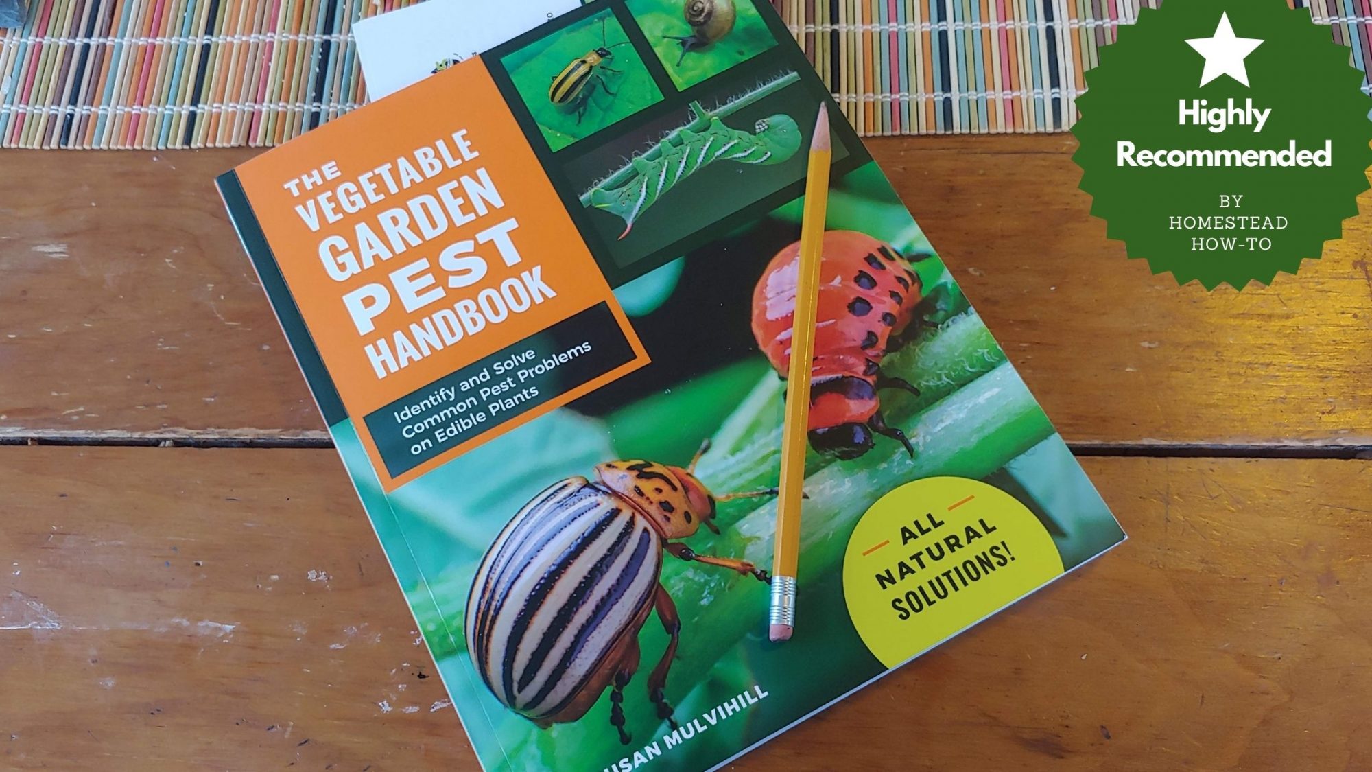Garden Pest book on table with highly recommended seal of approval