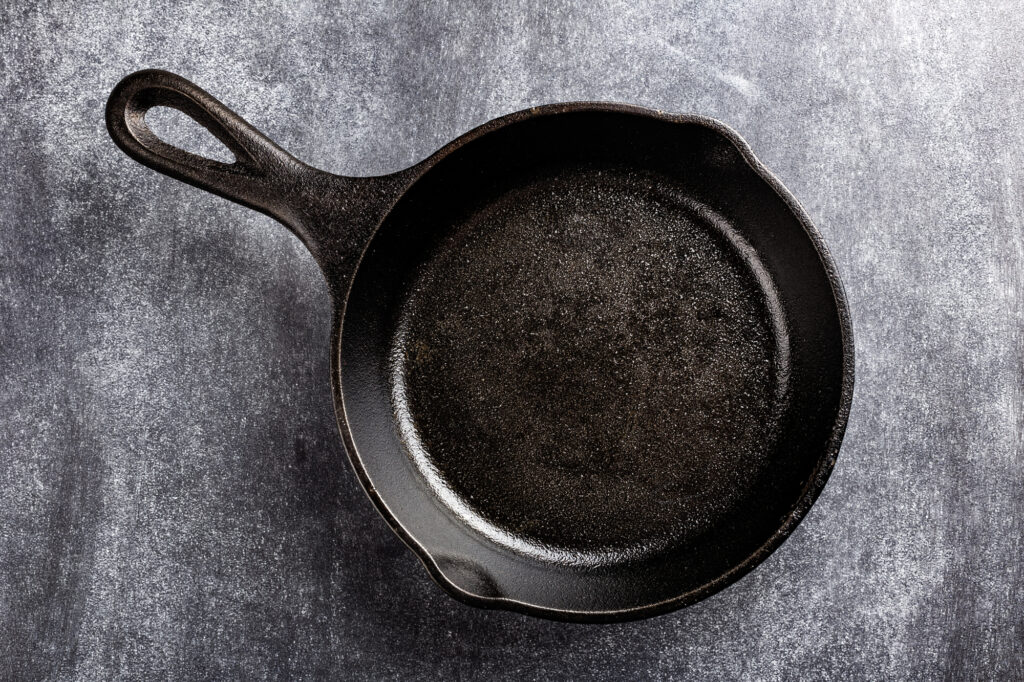 cast iron pan on dark background