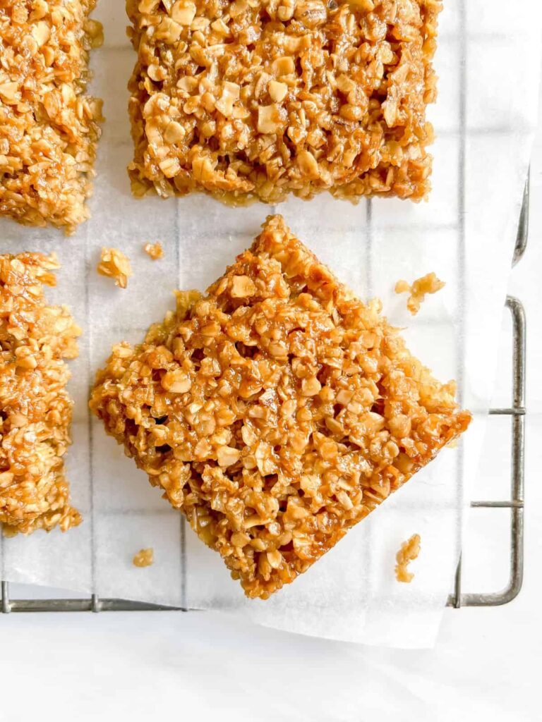 maple syrup flapjacks on parchment paper on a wire rack
