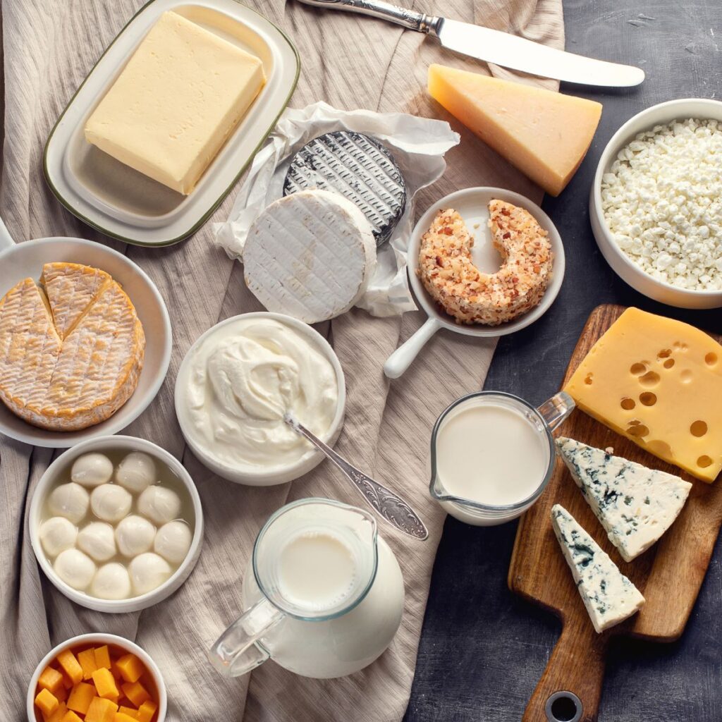 various cheeses and other dairy products on a table
