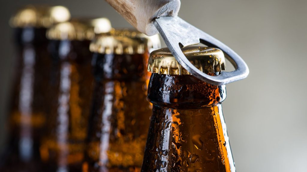 The Best Natural Methods to Keep Slugs Out of Your Garden 7 Brown ice cold beer bottles with water drops and old opener