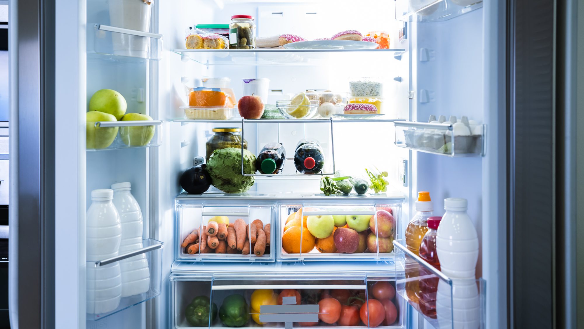 Here's the Secret to Making Your Groceries Last Longer 8 Open Refrigerator Or Fridge Door With Food Inside
