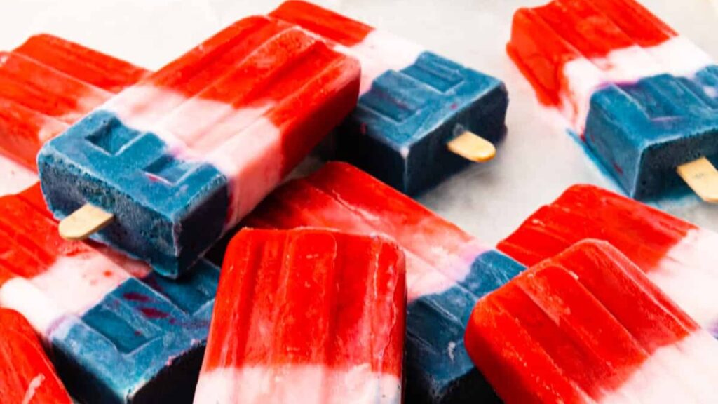 21 Delightful Homemade Popsicle Recipes 6 A pile of red, white, and blue popsicles.