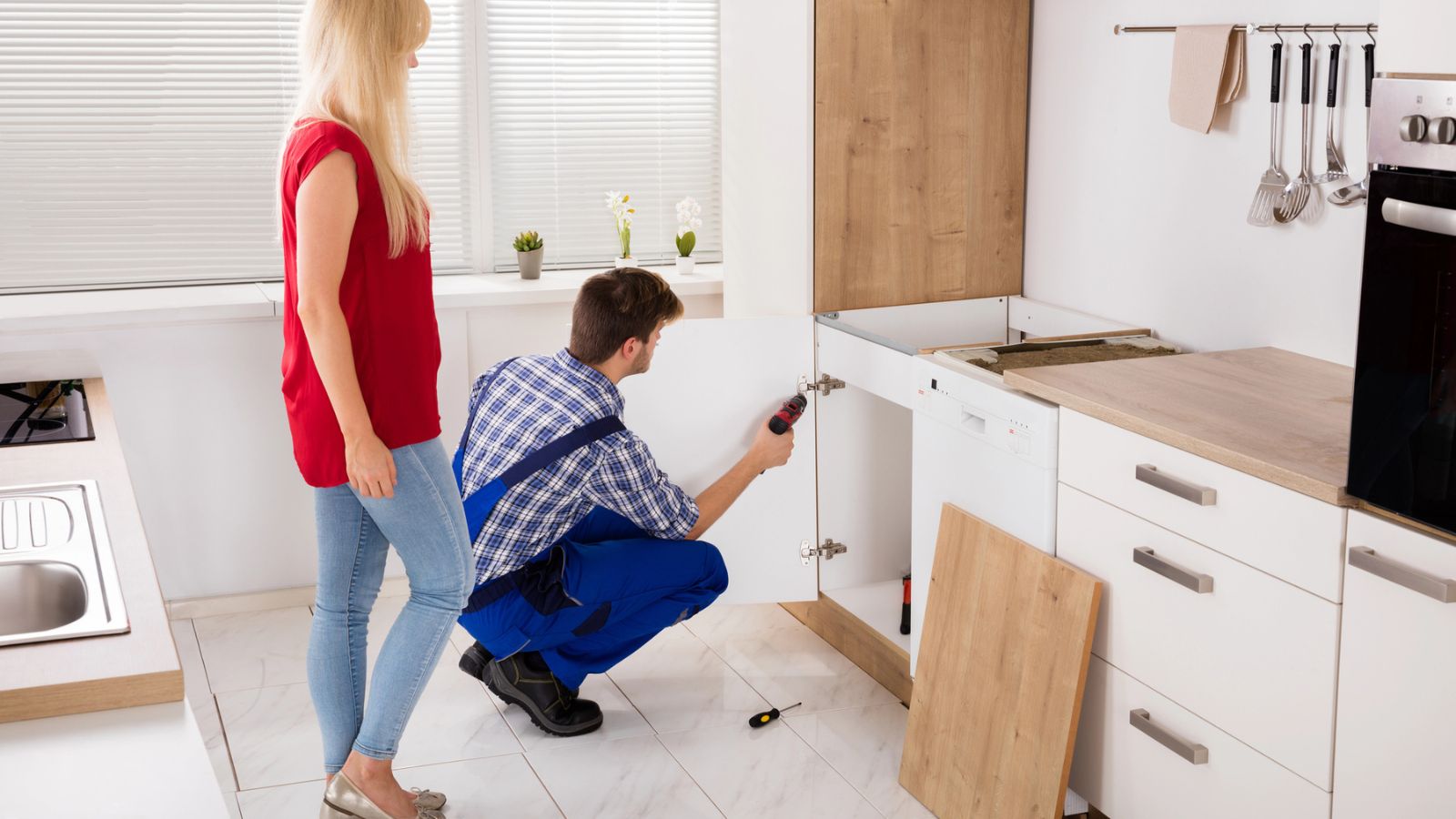 Repairman Fixing Door.