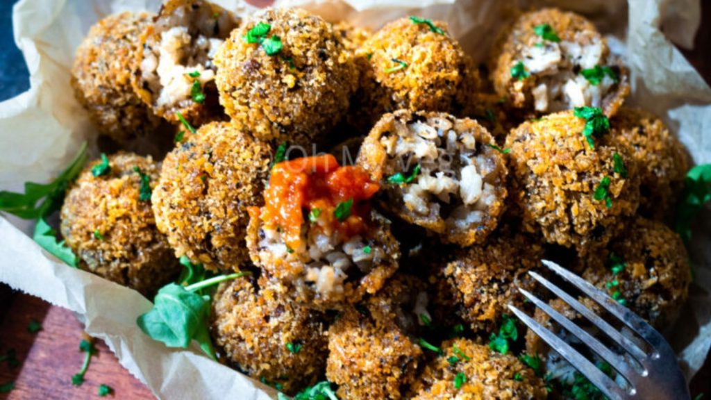 28 Incredibly Tasty Mushroom Recipes With Freshly-Foraged Flavors 6 Vegan mushroom arancini in a pile.