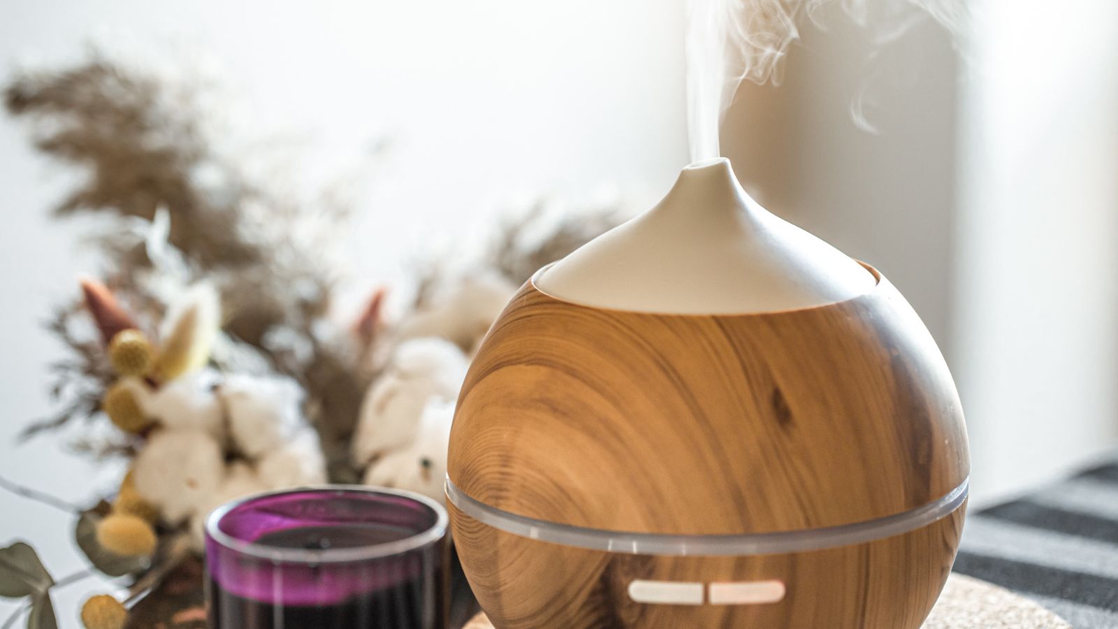 Aroma oil diffuser lamp on a table