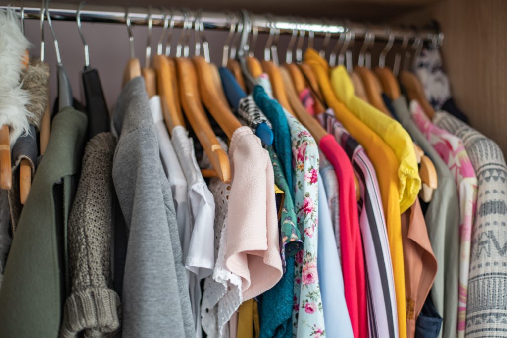14 Things You Should Never Store in the Basement 8 Wardrobe closet full of colorful clothes in dressing-room