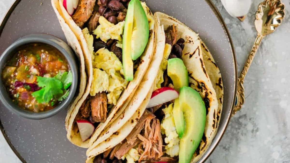 18 Crockpot Recipes That Practically Make Themselves 16 Slow Cooker Pork Carnitas and Eggs Breakfast Tacos