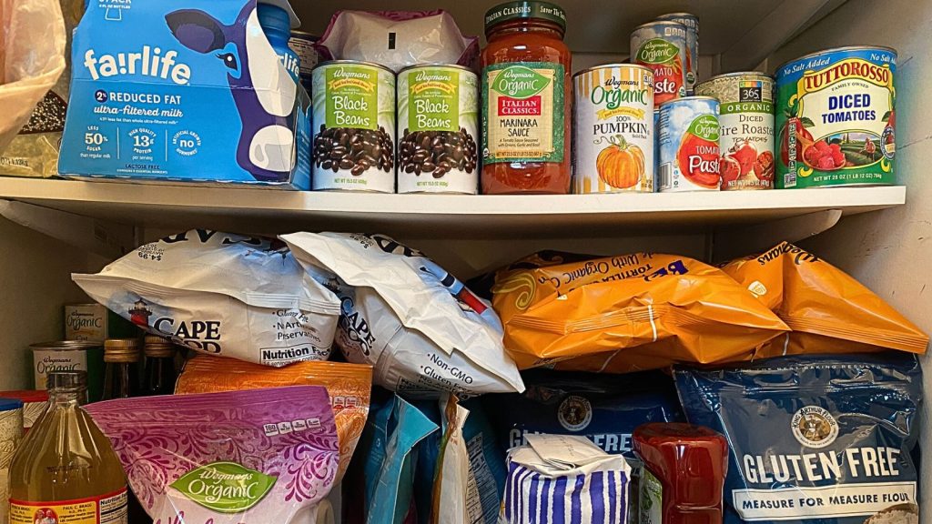 14 Food Storage Rules Every Prepper Should Follow 1 stocked pantry canned and dry goods