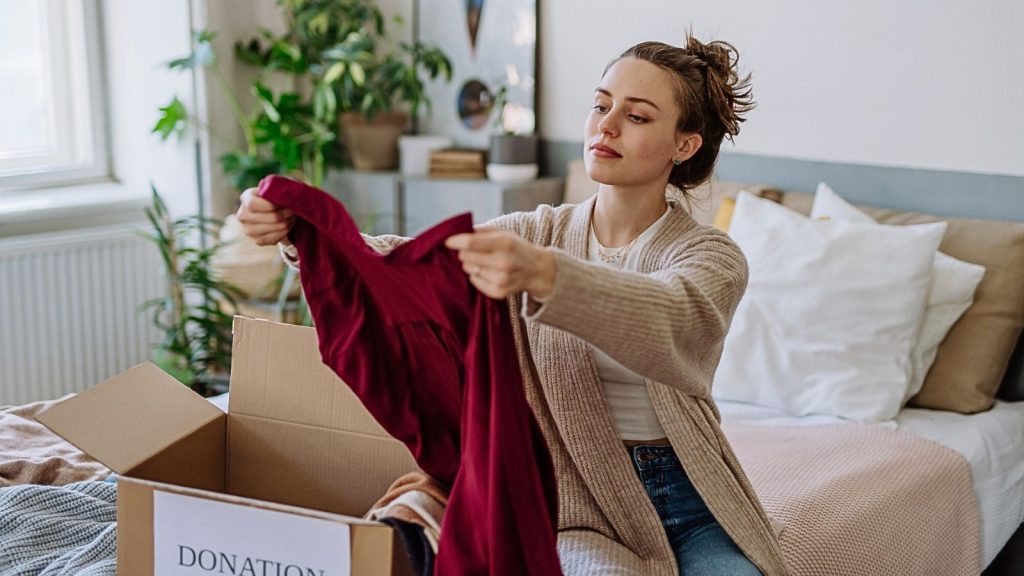 woman with clothes for donation