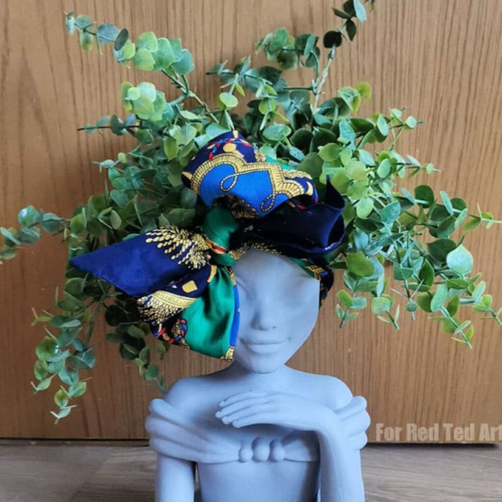 25 Creative Ways to Turn Old Junk into Beautiful Planters for Your Garden 15 Doll Head Planter