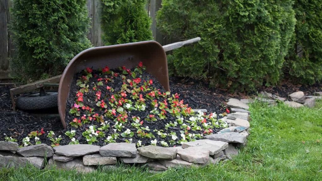 25 Creative Ways to Turn Old Junk into Beautiful Planters for Your Garden 10 DIY Tipped Wheelbarrow Planter