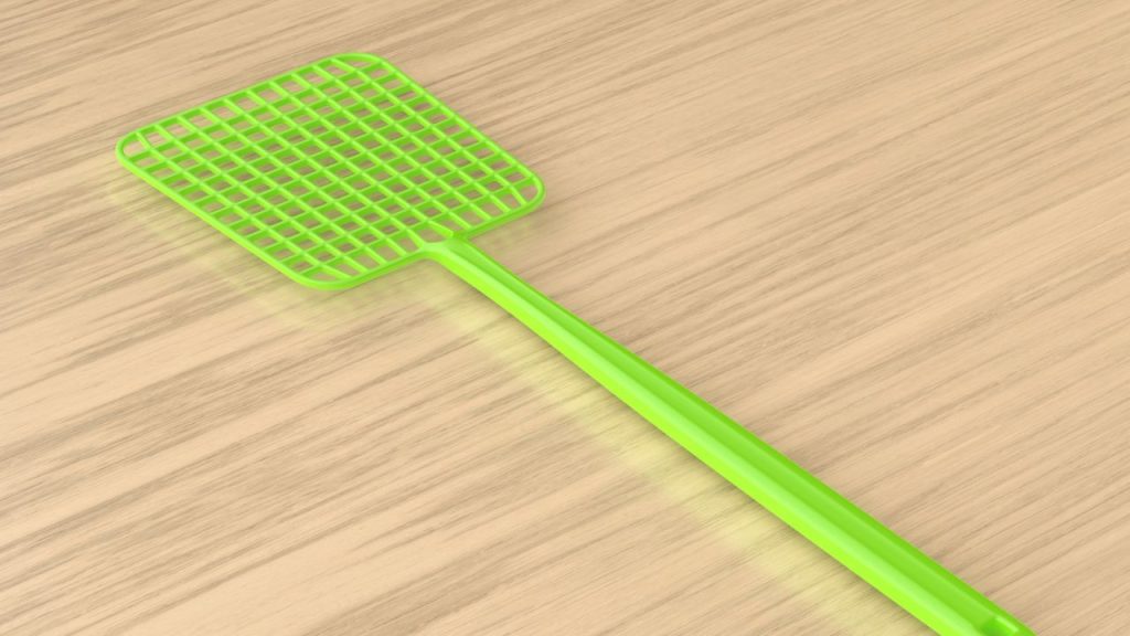19 Survival Uses for Rubber Bands Everyone Should Know 15 Green fly swatter on a wooden table