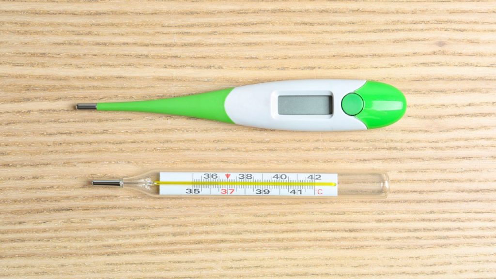 15 Over-the-Counter Medications You Should Stockpile 15 Modern digital and mercury thermometers on wooden table, flat lay