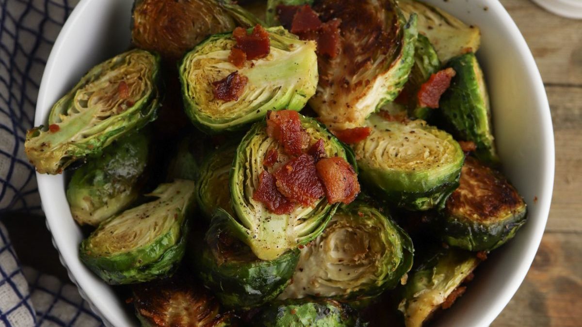 The Best Bacon Recipes You’ll Ever Make 4 Roasted brussels sprouts with bacon in a bowl.