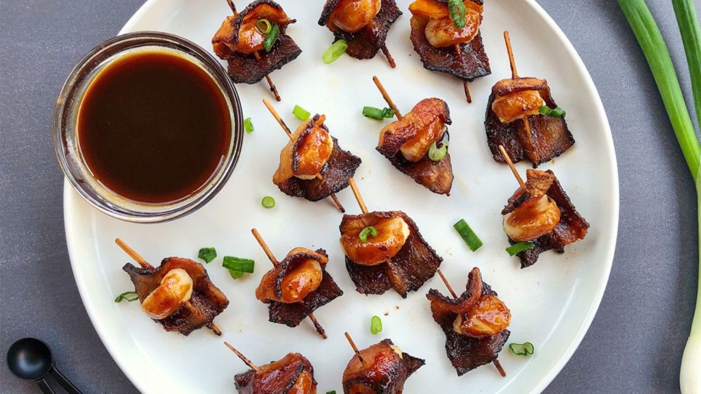 The Best Bacon Recipes You’ll Ever Make 19 crispy bacon wrapped water chestnuts with dipping sauce and green onion topping
