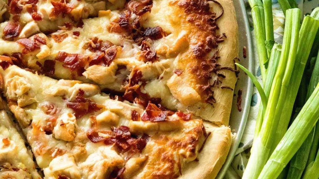 The Best Bacon Recipes You’ll Ever Make 11 Homemade sliced pizza with chicken, bacon and ranch on it