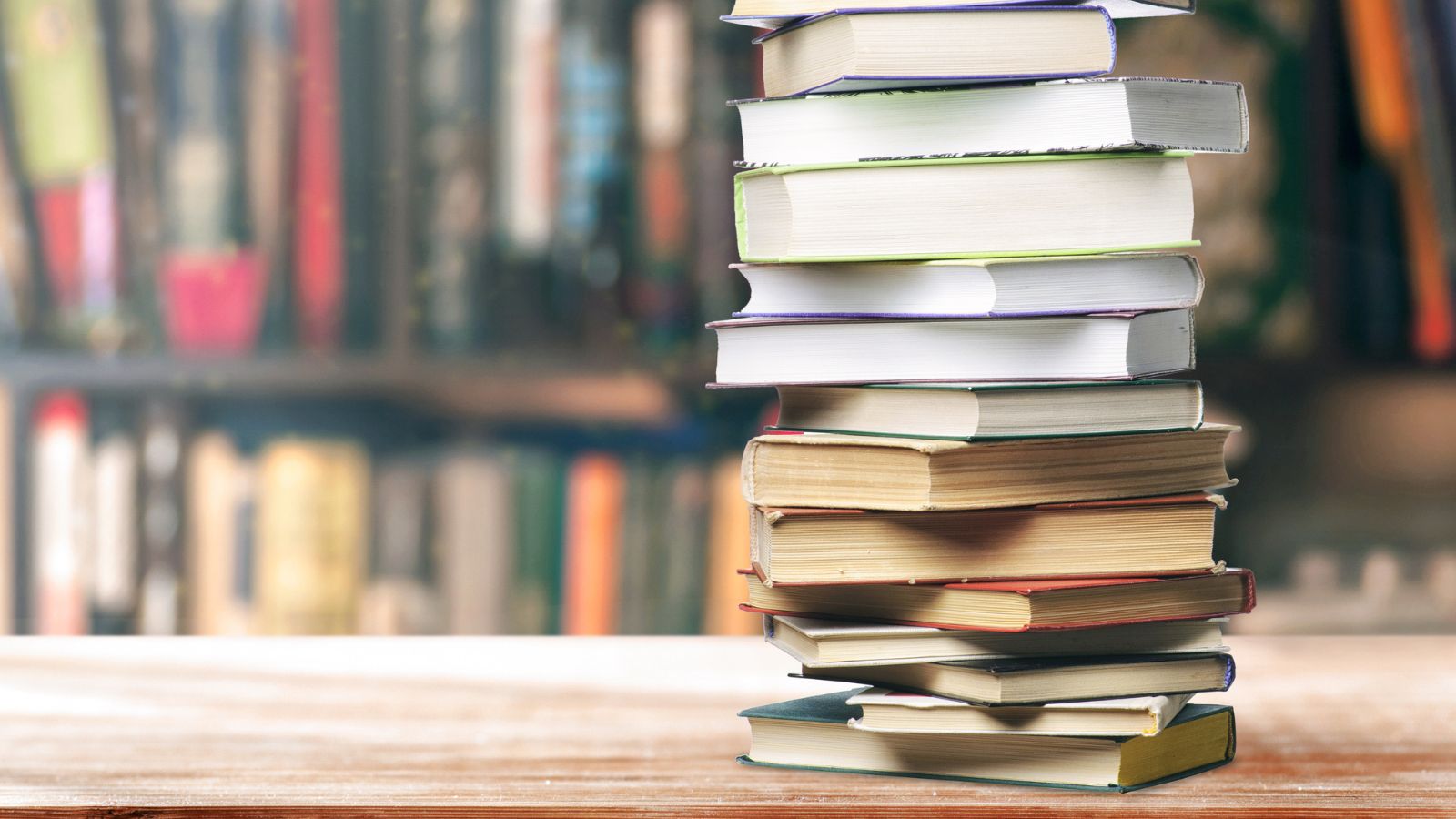 Don’t Toss Those Old Books: Here Are 14 Responsible Ways to Get Rid of Them 4 stack of books in library