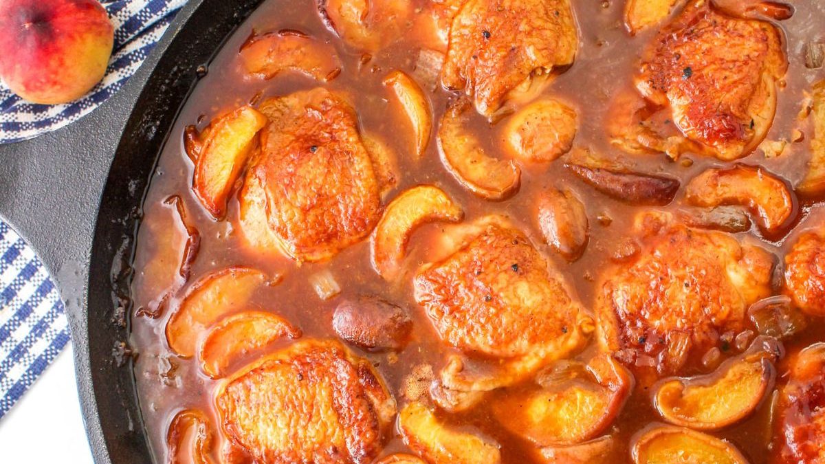 24 Chicken Dinner Recipes for When You’re Out of Ideas 9 Peach chicken in a skillet with peaches.