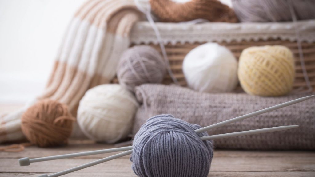 Cheap Items that Will Be Valuable When SHTF 6 Knitting and knitting needles on a wooden surface