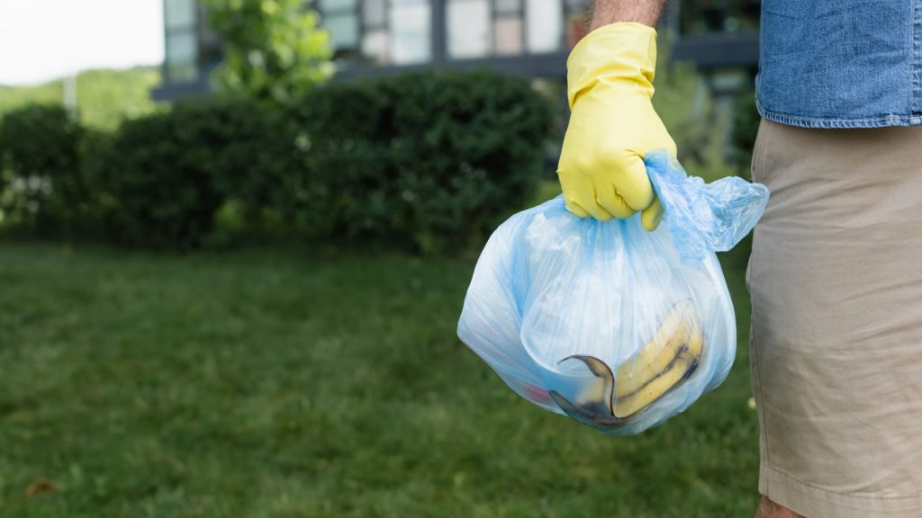 21 Essential Emergency Supplies That Every Home Should Have Stocked 5 a man holding a garbage bag