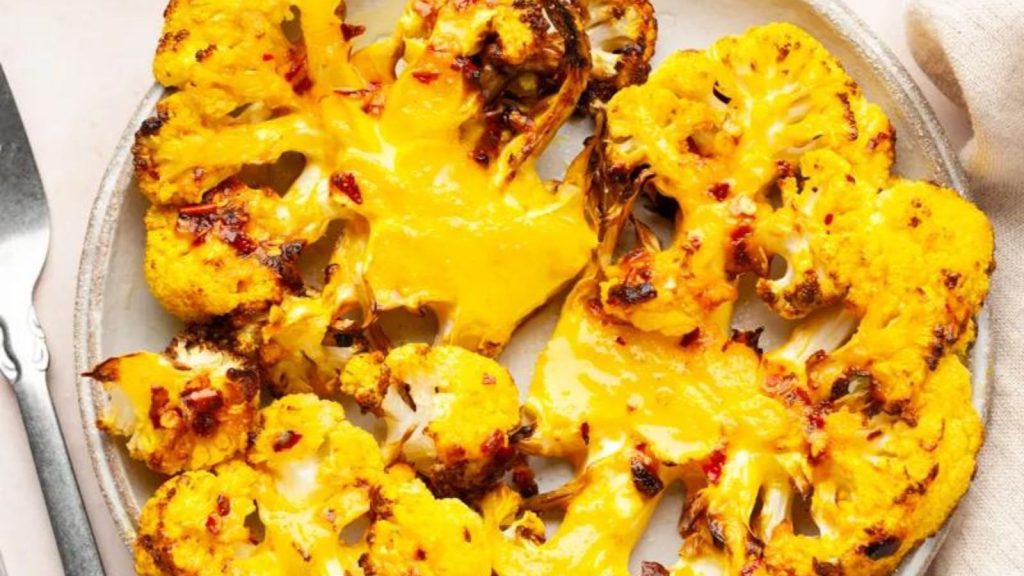 23 Easy, Tasty, and Totally Addictive Air Fryer Vegetables 15 Crispy air fryer cauliflower steaks on a plate.