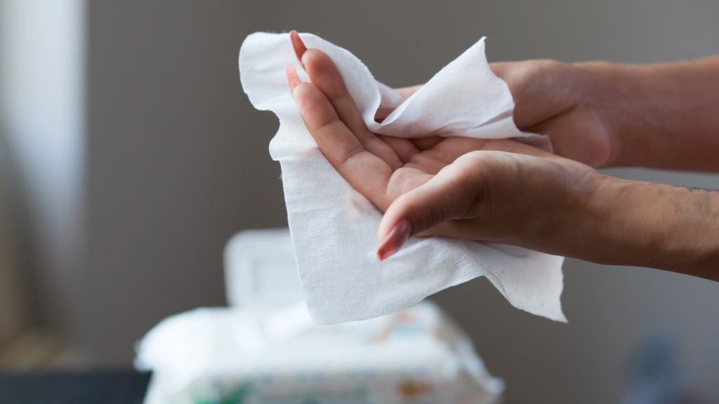 21 Essential Emergency Supplies That Every Home Should Have Stocked 3 wiping hands with wipes