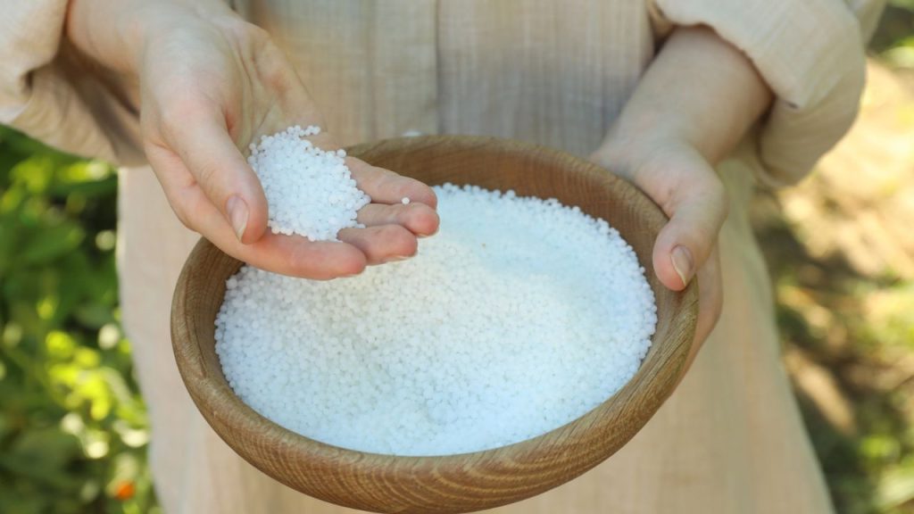 The Best Natural Methods to Keep Slugs Out of Your Garden 13 woman holding epsom salt