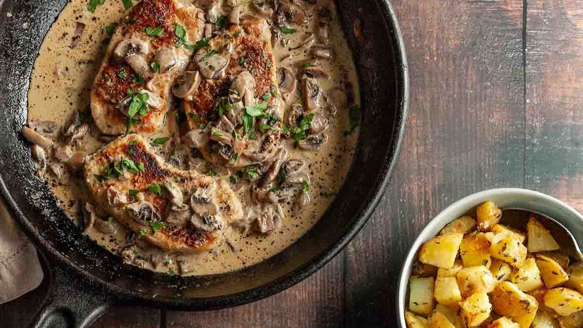24 Dinner Recipes to Make in Grandma's Favorite Cast Iron Skillet 16 Cast Iron Skillet Pork Chops and Mushrooms by Camp Grill Eat