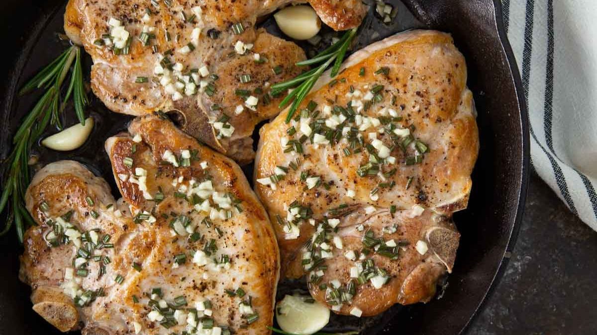 24 Dinner Recipes to Make in Grandma's Favorite Cast Iron Skillet 22 Garlic Rosemary Pork Chops by The Blond Cook