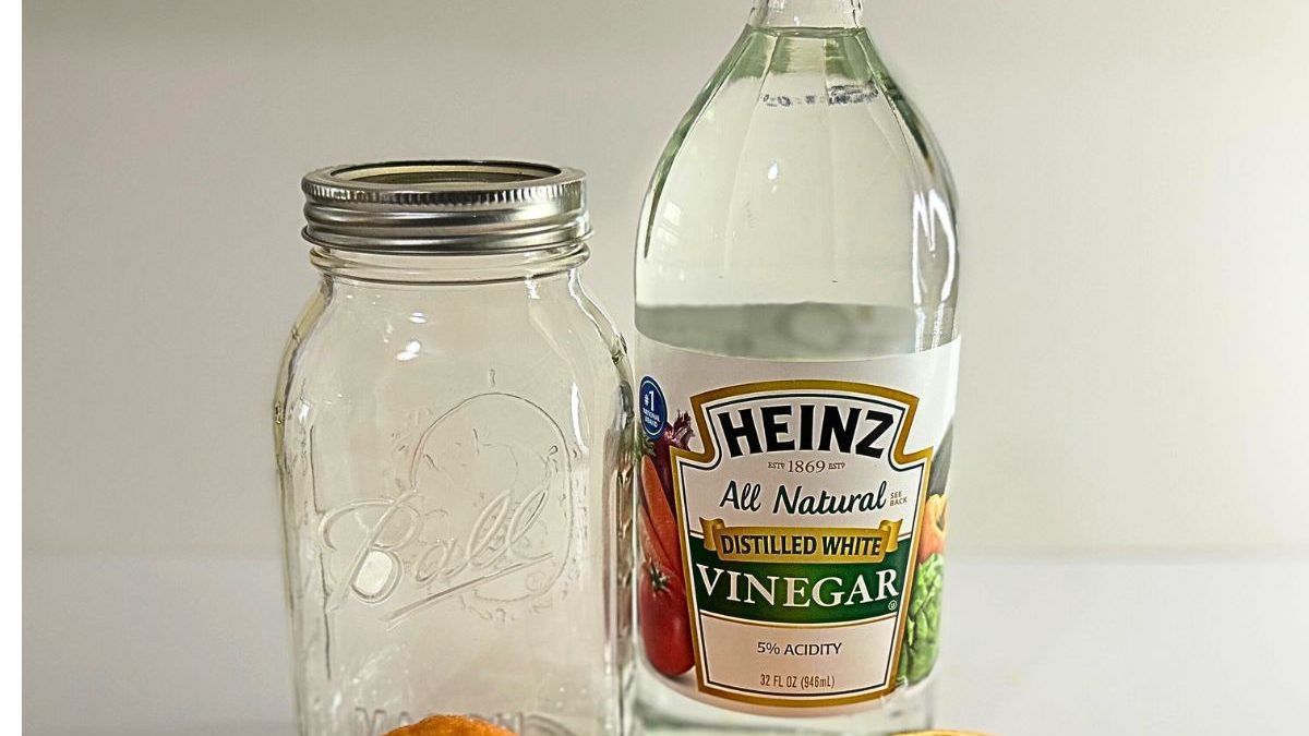 16 Kitchen Secrets from Grandma That Make Life Easier 11 orange peels in mason jar and vinegar