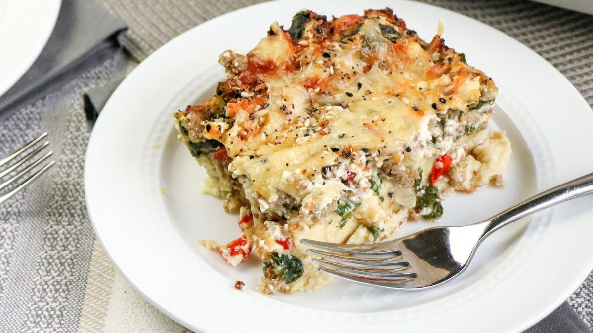 23 Breakfast Casseroles That Make Mornings Easier 2 A plate of lasagna on a table next to a fork.