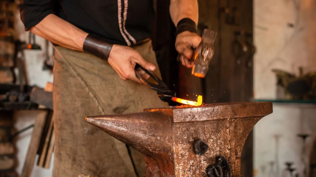 15 Survival Skills Everyone Needs to Know but Few Will Have in a Crisis 10 metal being worked at a blacksmith forge Blacksmith working on metal on anvil at forge