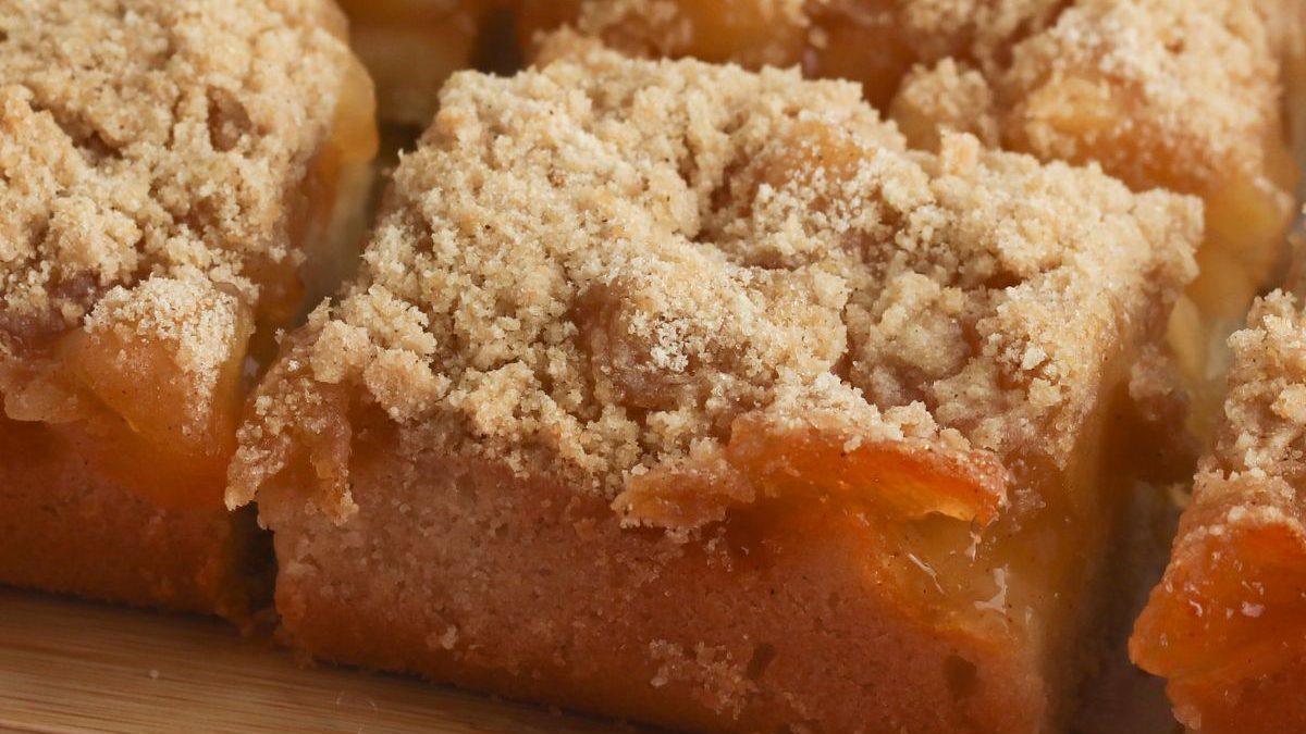 19 Sweet Treats That Start With a Can of Apple Pie Filling 2 Apple crumble bars on a wooden cutting board.