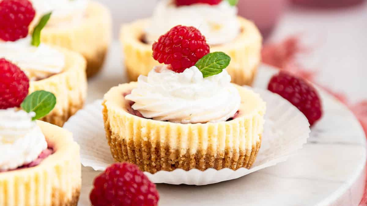 22 Raspberry Desserts That Are Bursting with Flavor 1 Raspberry Swirl Mini Cheesecakes