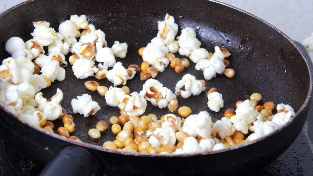 cooking popcorn in a pan