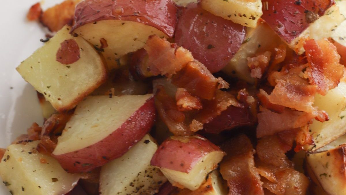 24 Potato Recipes You’ll Never Get Tired Of 8 A plate with potatoes and bacon on it.