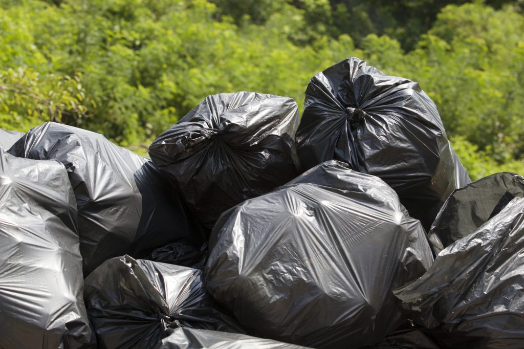 16 Essential Items to Stock Before the Next Power Outage Hits 7 garbage bags piles of trash