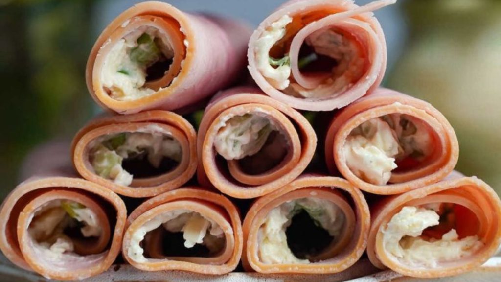 holding up ham roll