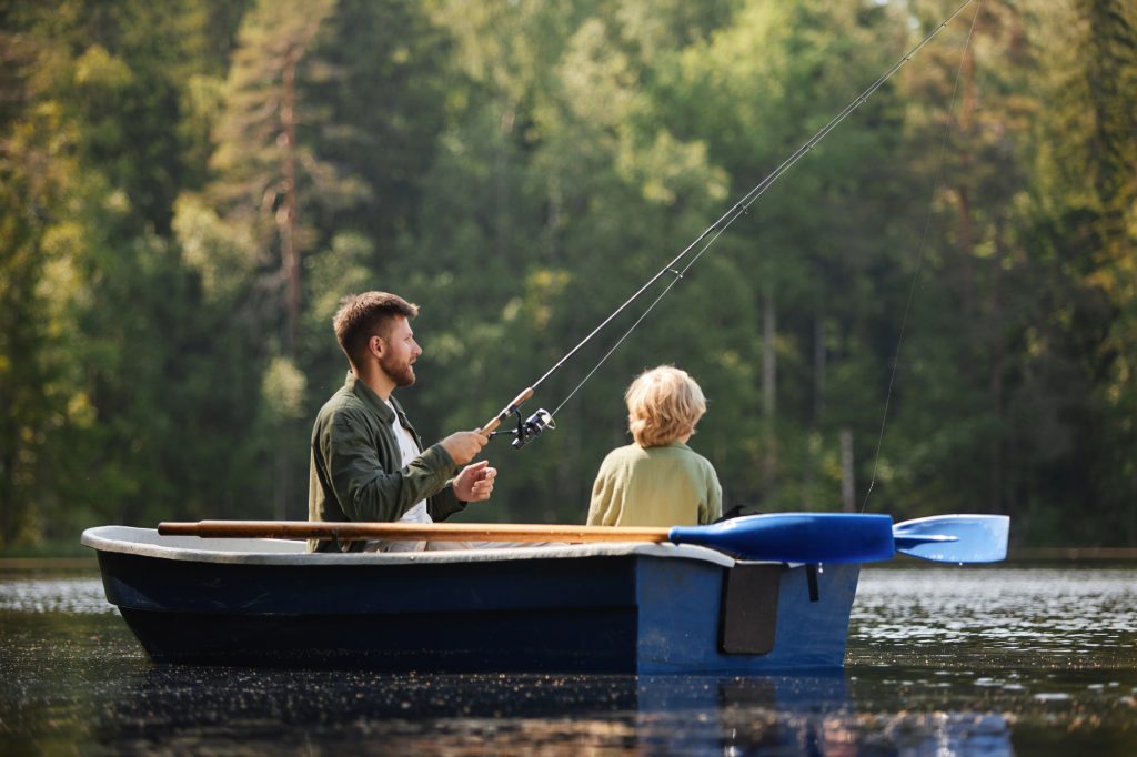 20 Pioneer Skills to Learn Now So You Can Rely Less on the Grid Later 1 man fishing with child
