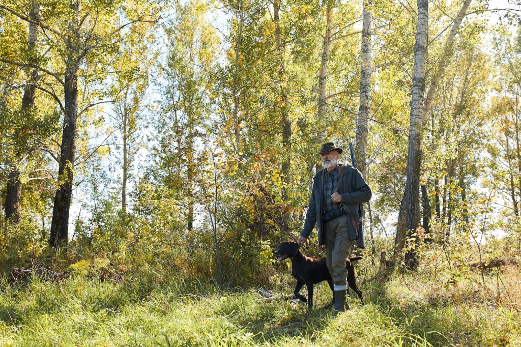 20 Pioneer Skills to Learn Now So You Can Rely Less on the Grid Later 4 man hunting with dog in woods