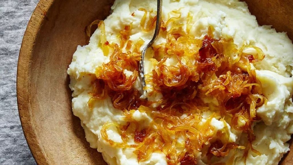 24 Potato Recipes You’ll Never Get Tired Of 21 Mashed potatoes with caramelized onions and goat cheese in a wooden bowl.