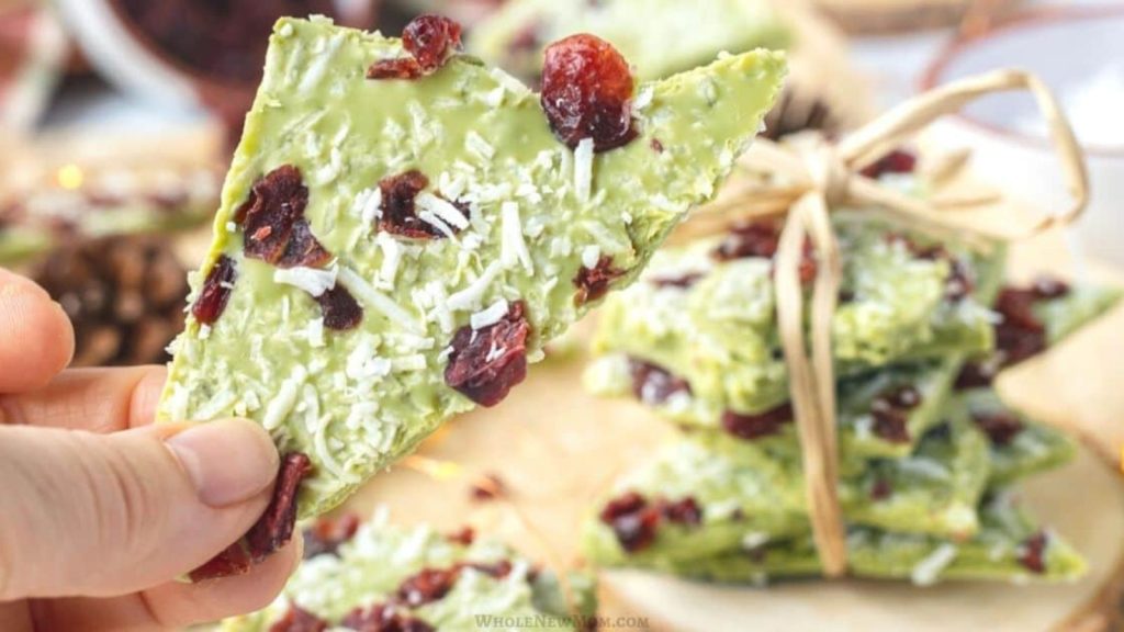 20 Matcha Recipes That’ll Make You Forget Chocolate Exists 19 hand holding piece of matcha bark
