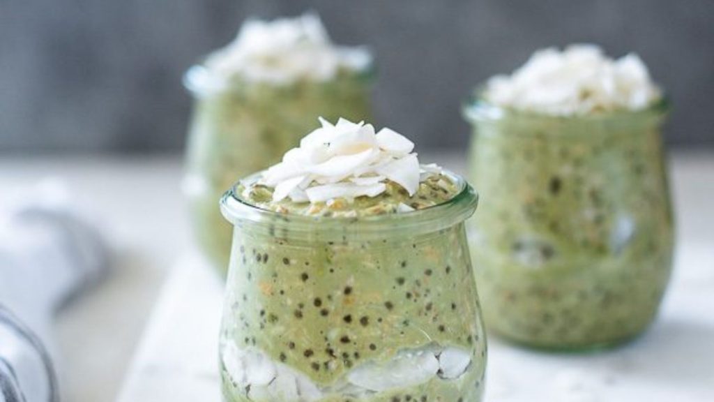 20 Matcha Recipes That’ll Make You Forget Chocolate Exists 15 jar of matcha overnight oats with coconut on top a spoon with green tea