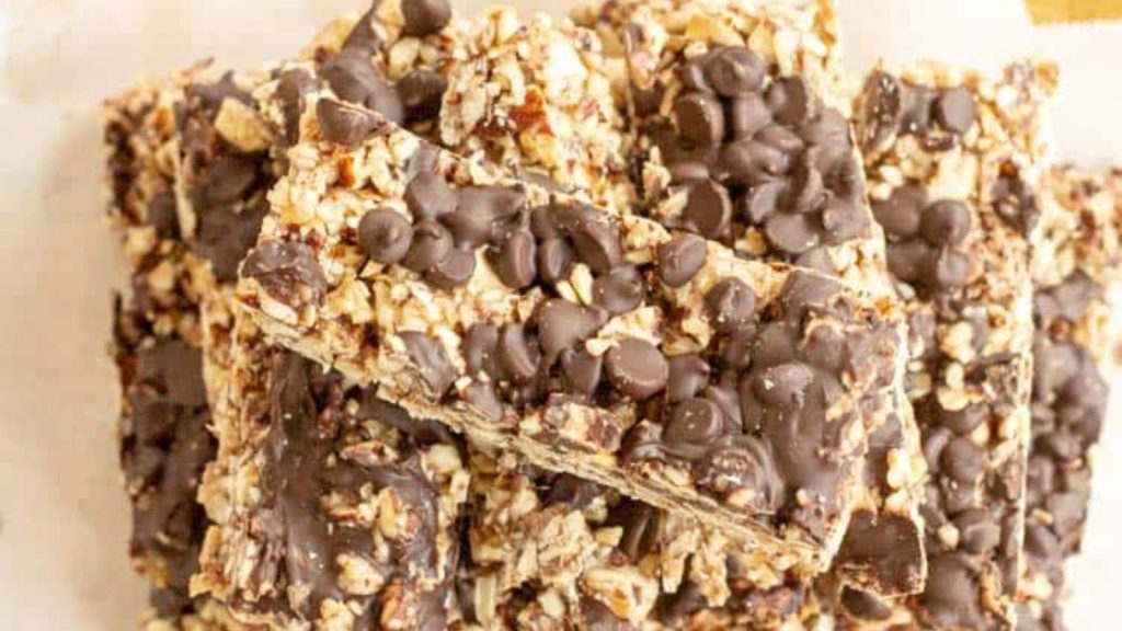 pile of no bake keto granola bars on a white plate from above