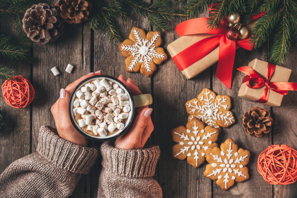 How I’m choosing to romanticize the holiday season with slower, sweeter, more nostalgic moments 1 woman with hot cocoa christmas